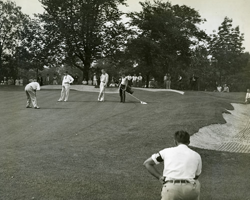 Golfers playing in professional golf tournament